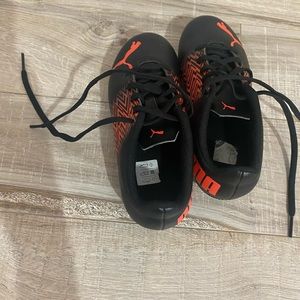 Puma soccer shoes for kids Size 13 U.S 12 UK.   Color black & red